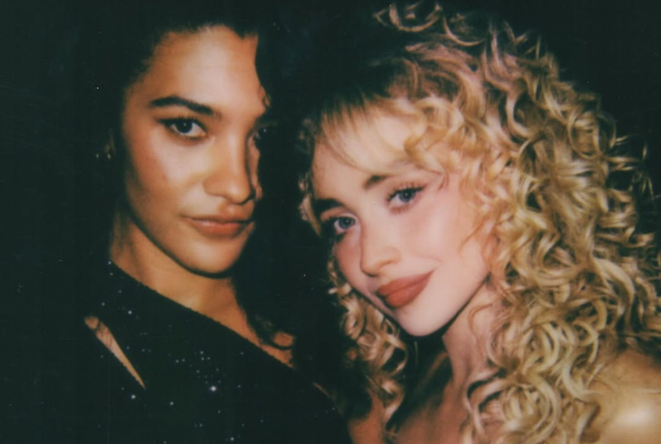 Sabrina and Olivia singing onstage