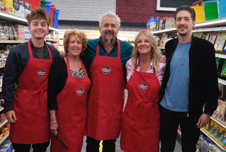 Guy Fieri filming with crew support