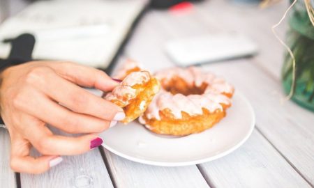 Delicious homemade glazed donut on a white plate